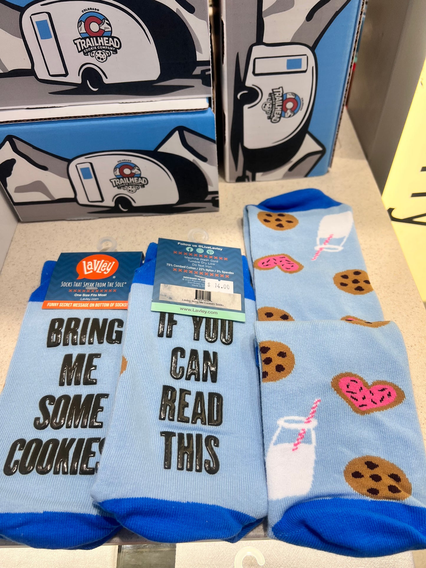 Pair of socks with cookie design and text "If you can read this bring me cookies"