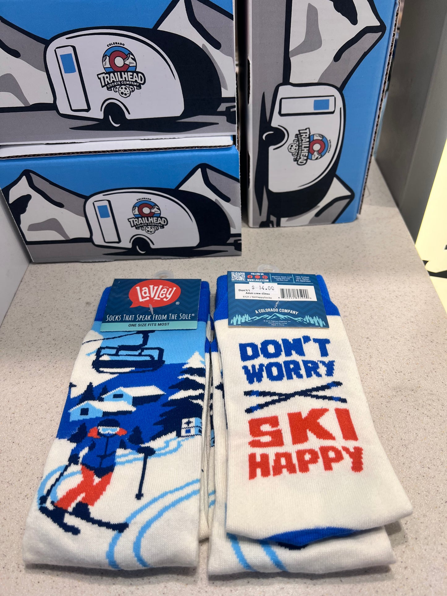 Ski-themed socks and text 'don't worry ski happy'