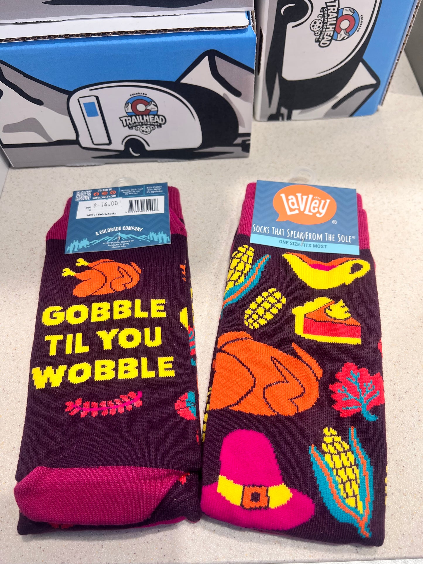 Colorful socks with Thanksgiving-themed design and goggle till you wobble saying