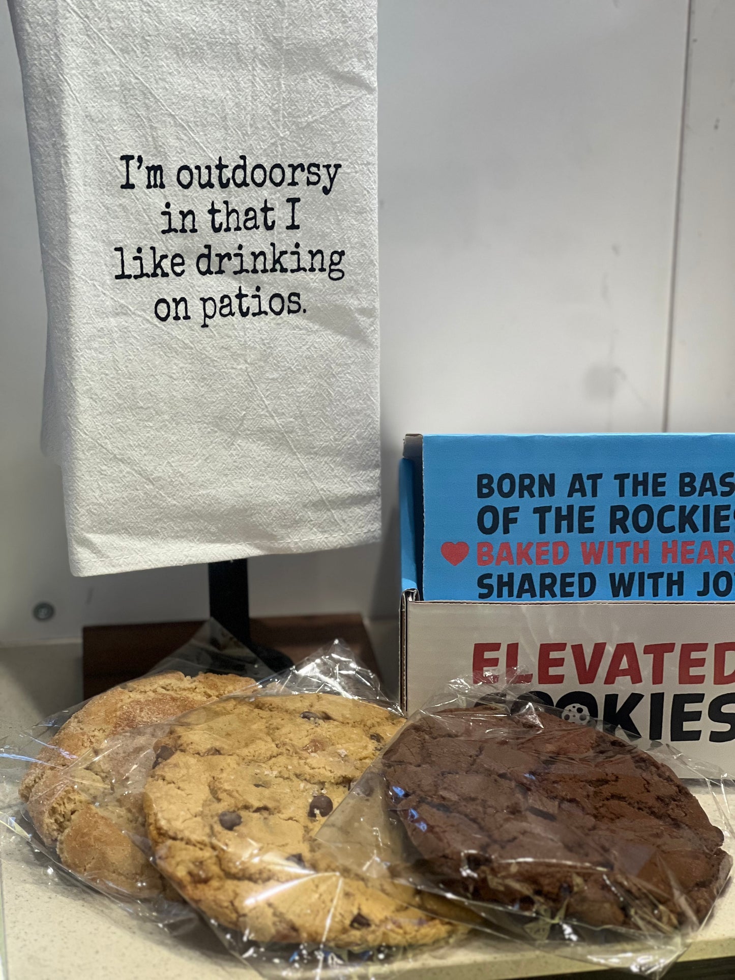 Cookies on a table with a humorous towel 