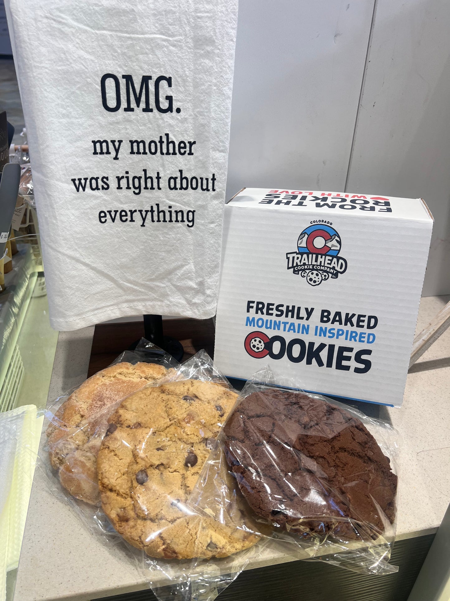 Funny towl, trailhead Cookies packaging with cookies on a shelf