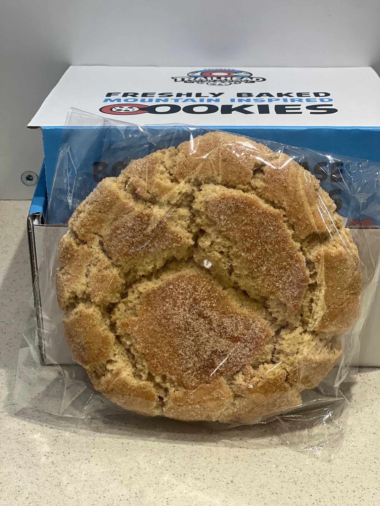 Packaged cookies with a visible brand label on a neutral background